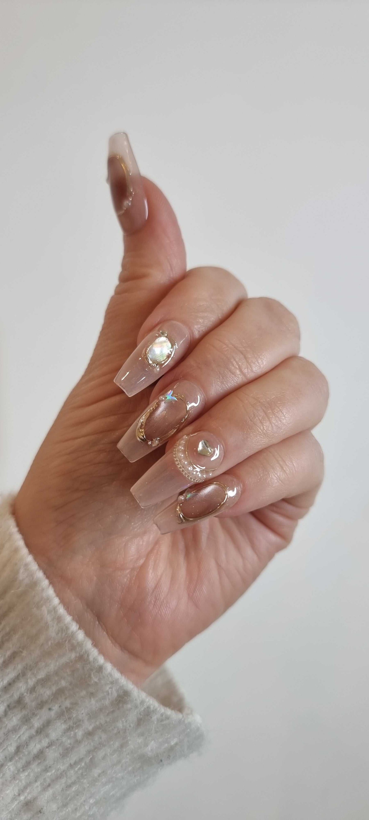 High-fashion manicure using the long Zaynah Coffin press-on nails set.