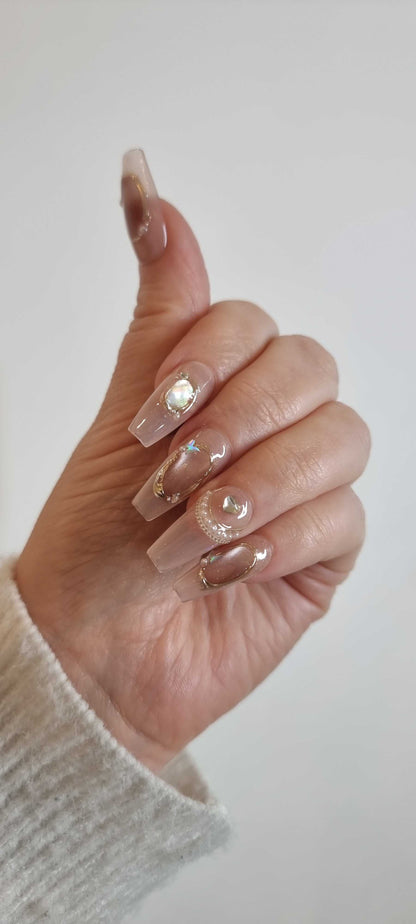 High-fashion manicure using the long Zaynah Coffin press-on nails set.