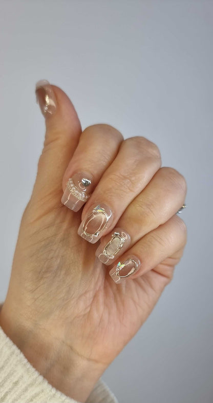 glossy coffin nails 2	Image showing a different angle of the Zaynah Short neutral-toned, glossy coffin nails.